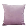A square velvet throw pillow cover in a dusty mauve color.