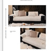 A beige thickened plush sofa seat cushion with vertical pleats shown on a black sofa.