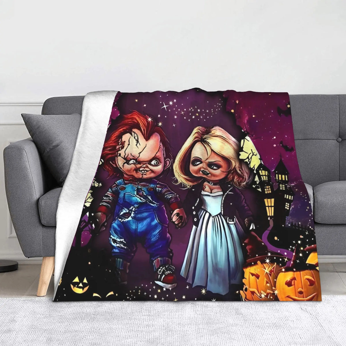 A dark purple horror themed blanket featuring Chucky and other spooky elements.