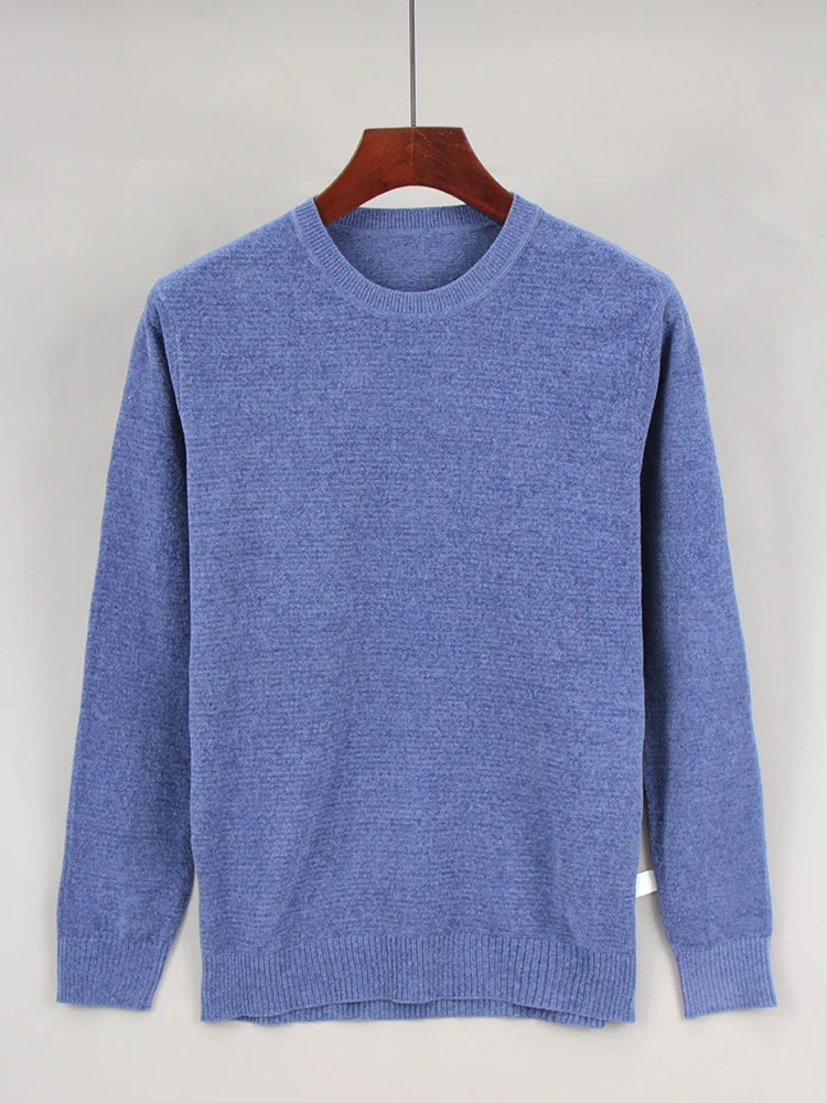 A light blue crewneck sweater with a ribbed collar and long sleeves, displayed on a wooden hanger.