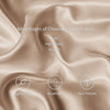 Close-up of silky satin fabric draped in a soft beige color highlighting its lightweight, breathable, and skin-friendly advan