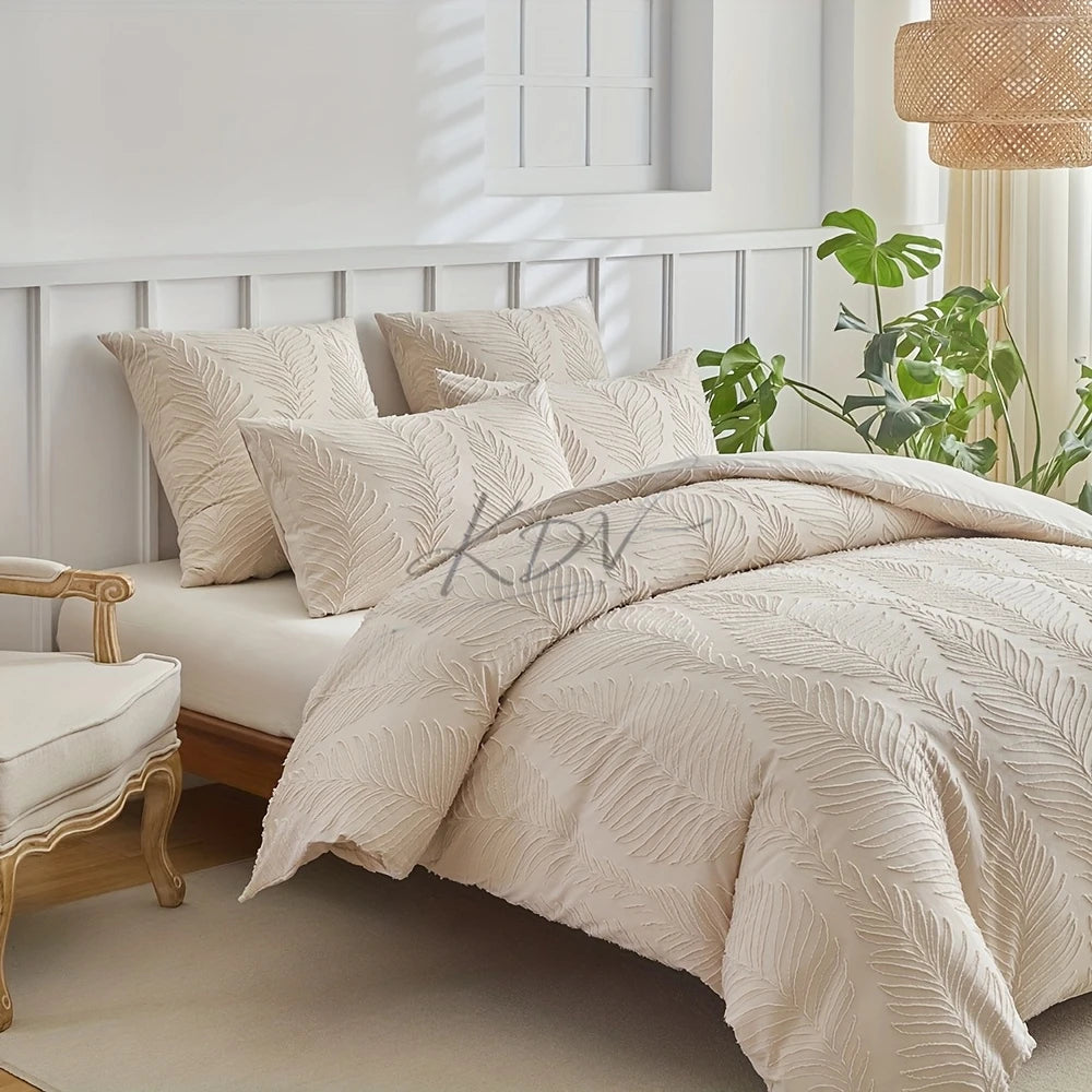 A beige embossed leaf duvet cover set displayed on a bed with white paneled walls and green foliage.
