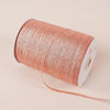 A roll of 10-meter gold and silver glitter satin ribbon is shown on a light background.