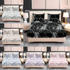 A collection of fitted sheet sets featuring various marble print patterns in black, white, and purple on beds.