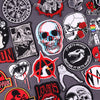 A collection of embroidered patches featuring skulls, roses, and various graphic designs on gray fabric.
