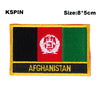 An embroidered patch featuring the flag of Afghanistan with the name AFGHANISTAN on a black background.