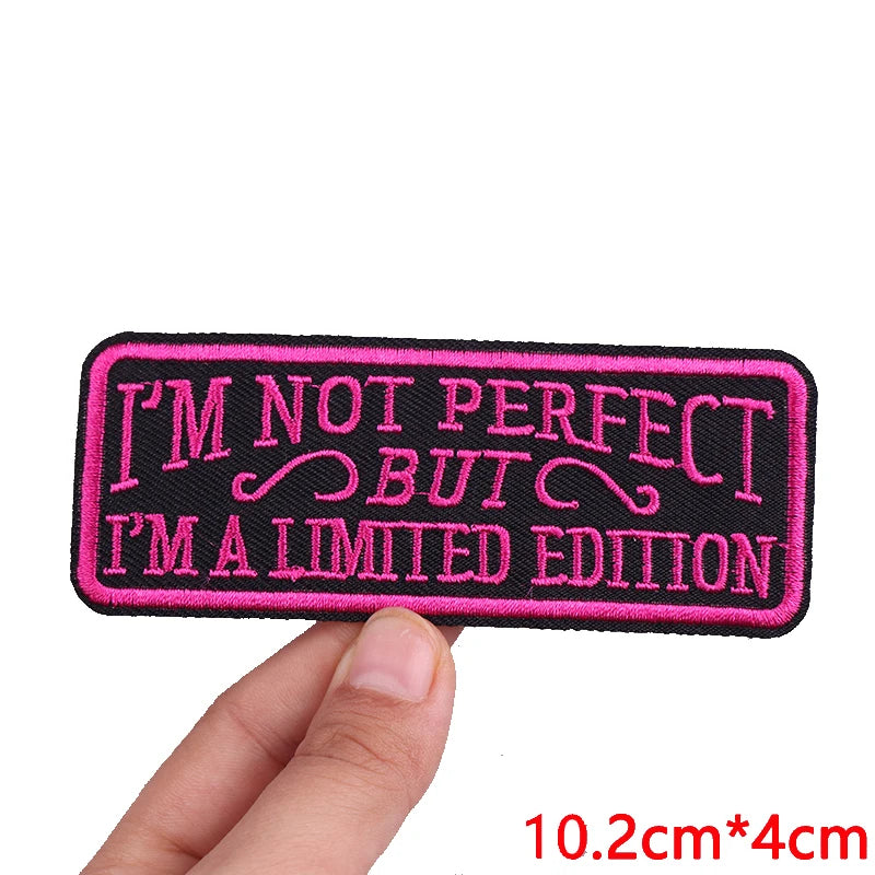 Black embroidered patch with pink text that reads I'M NOT PERFECT BUT I'M A LIMITED EDITION