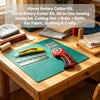 A precision rotary cutting kit with six blades, a ruler, and a knife laid out on a green cutting mat on a wooden table.