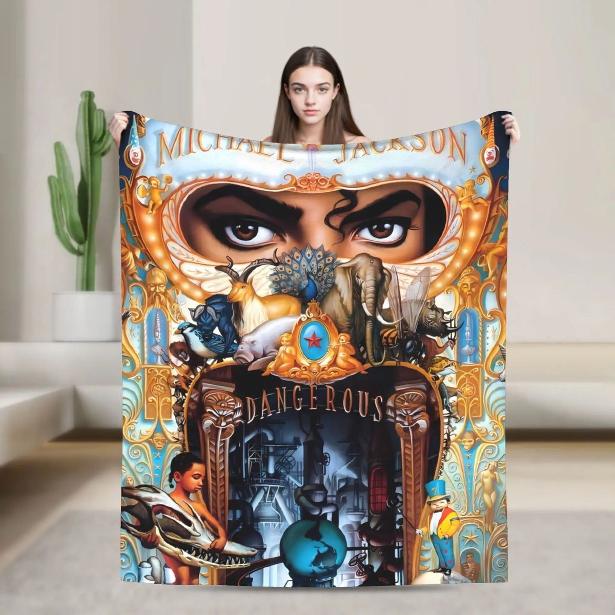A person holds up a large graphic plush throw blanket featuring a stylized face and text.