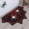 Black decorative non-slip mat featuring a red spiderweb design for bathroom or kitchen use