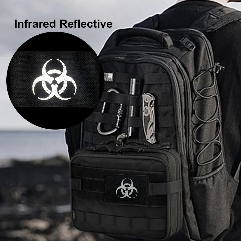 Black tactical backpack with infrared reflective patches on the front pocket.