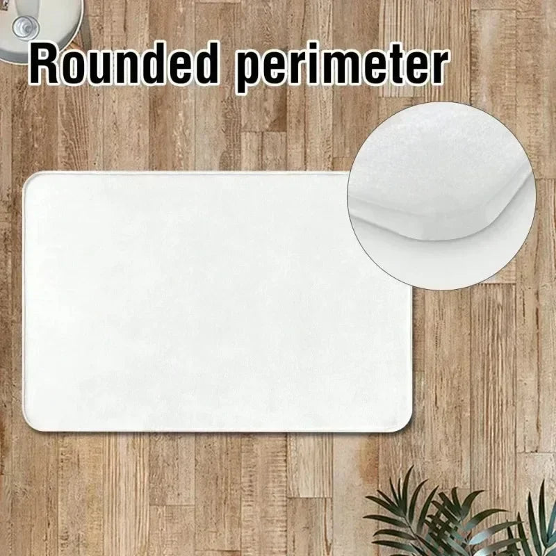 White rounded perimeter doormat placed on a wooden floor with a circular detail shown.