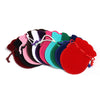 A set of ten velvet drawstring gift bags in various shades of pink, purple, green, and red.