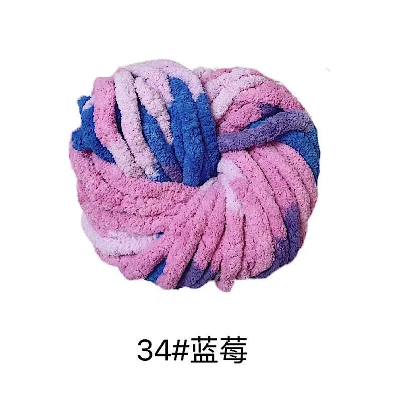 A ball of chunky acrylic yarn in shades of pink, blue, and purple for knitting and crochet projects.