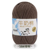 A ball of brown milk cotton yarn labeled in Chinese and English with a stitch count of 58.