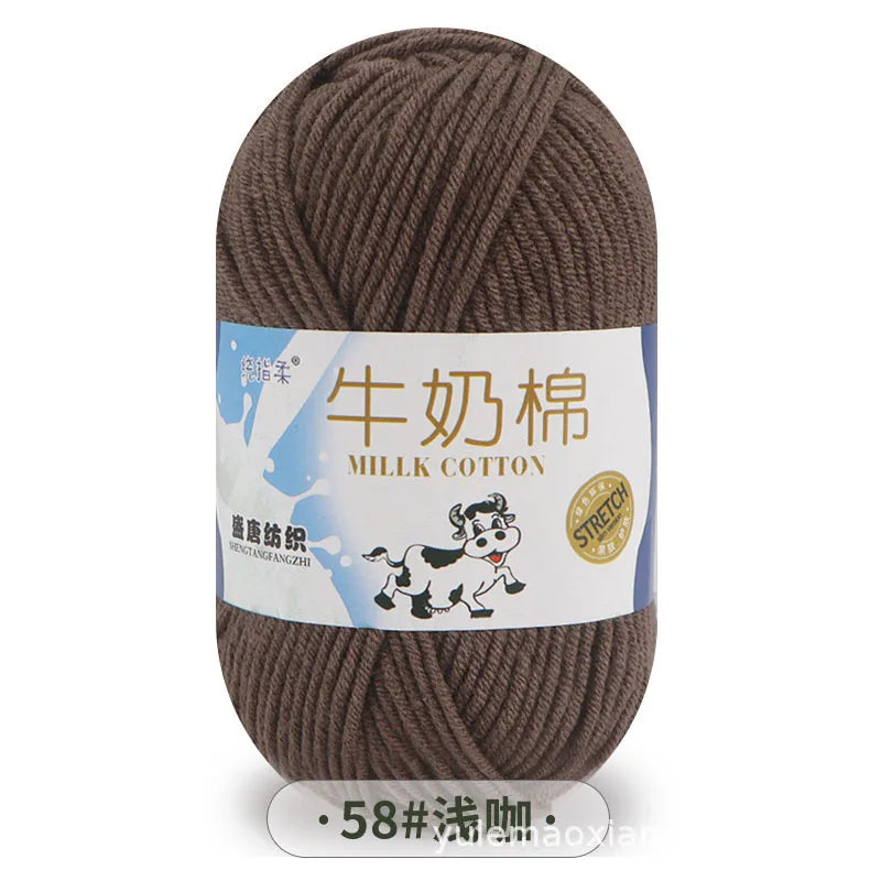 A ball of brown milk cotton yarn labeled in Chinese and English with a stitch count of 58.