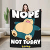 A black blanket featuring a large cartoon Pokémon character with a happy expression and the text NOPE NOT TODAY