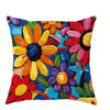 A decorative pillow cover featuring a vibrant floral pattern with orange, yellow, and pink flowers on a blue background.