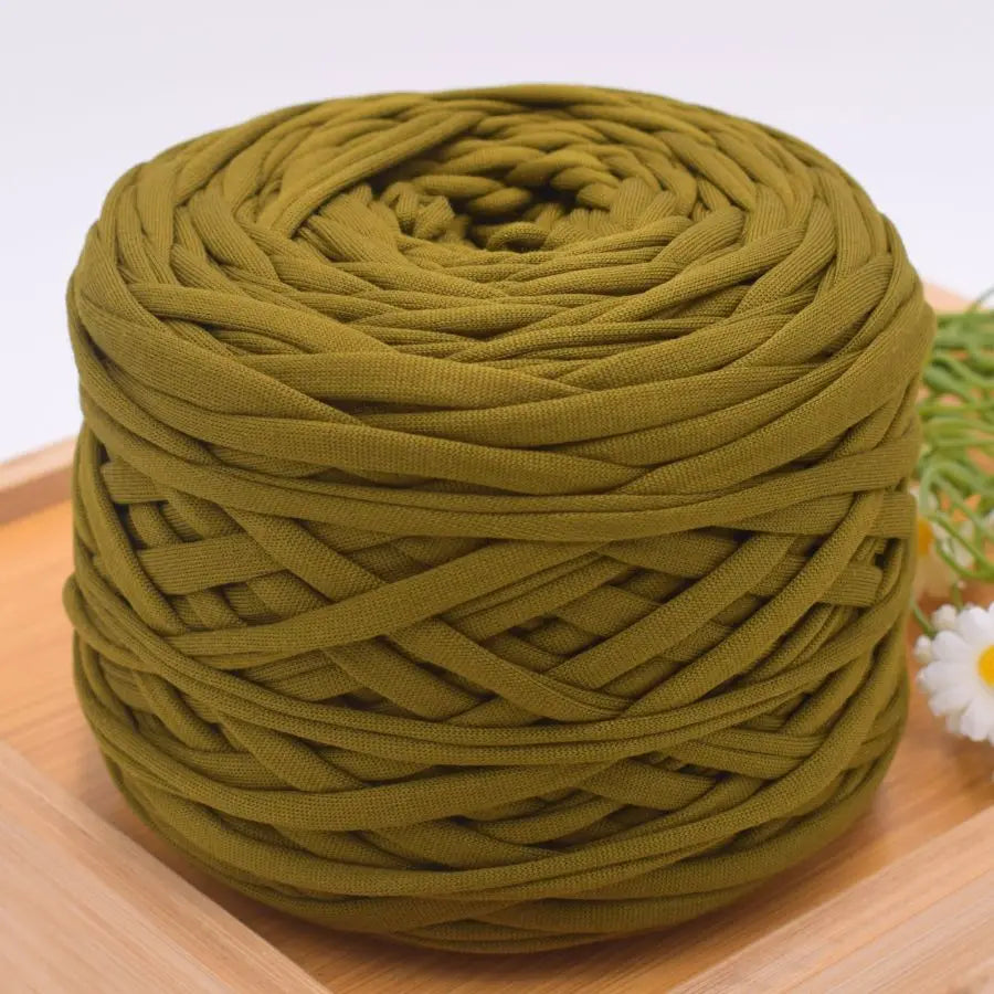 A ball of olive green craft yarn used for knitting and DIY projects.