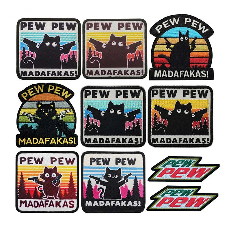 A collection of embroidered tactical patches featuring a cat meme design with the text PEW PEW and MADAFAKAS