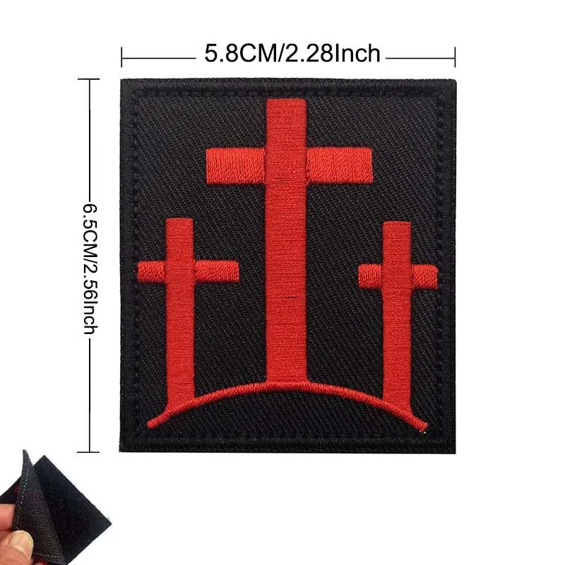 Black embroidered patch set featuring three red crosses in a church design.