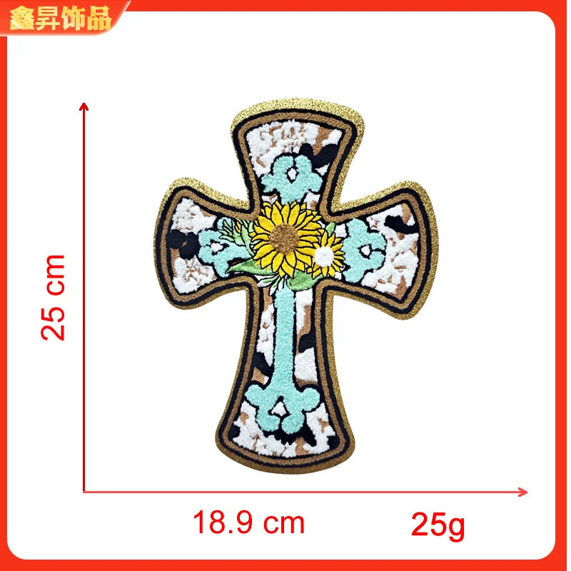 A gold-edged cross embroidery patch featuring a yellow flower design on a light blue background.