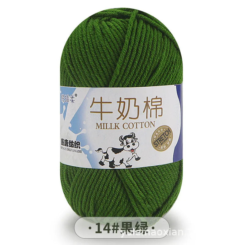 A ball of bright green milk cotton yarn labeled in Chinese and English with a stretch symbol.