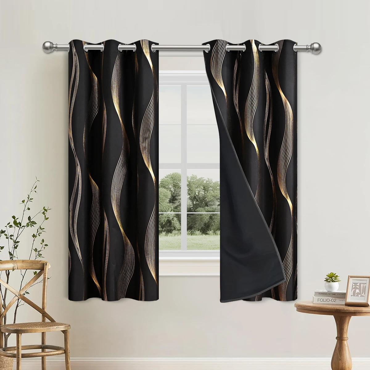 Elegant black blackout curtains with a golden wave pattern hanging in a window.