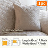 A single beige quilted sofa cushion cover displayed on a white sofa fabric.