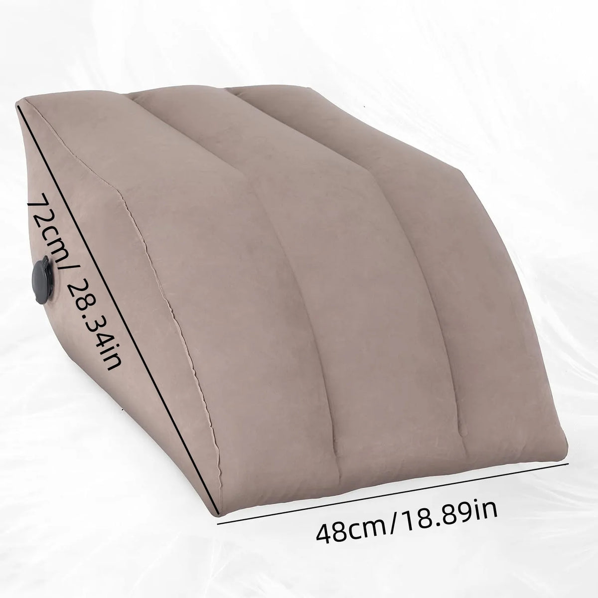 A beige inflatable leg elevation pillow shown from the side with measurements displayed.