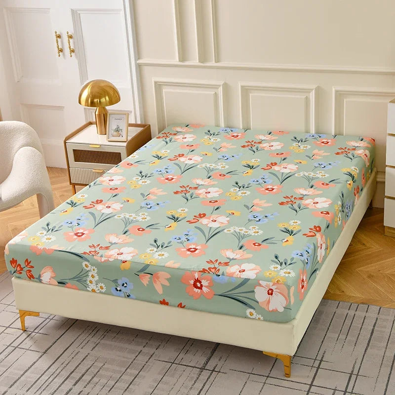 A floral fitted sheet set with pillowcases displayed on a bed in a bright room.