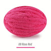 A ball of bright pink rose red extra thick hand-knitted yarn for crafting and gifts.