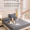 A waterproof and dirty mattress umbrella is shown above a fitted bed sheet set on a bed.