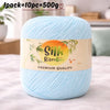 A ball of light blue silk bamboo blend yarn labeled premium quality for knitting and crochet.