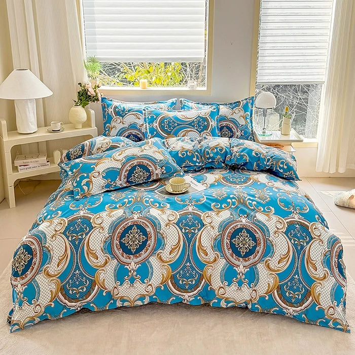 A blue and white marble print duvet cover set with pillows displayed on a bed near a window.