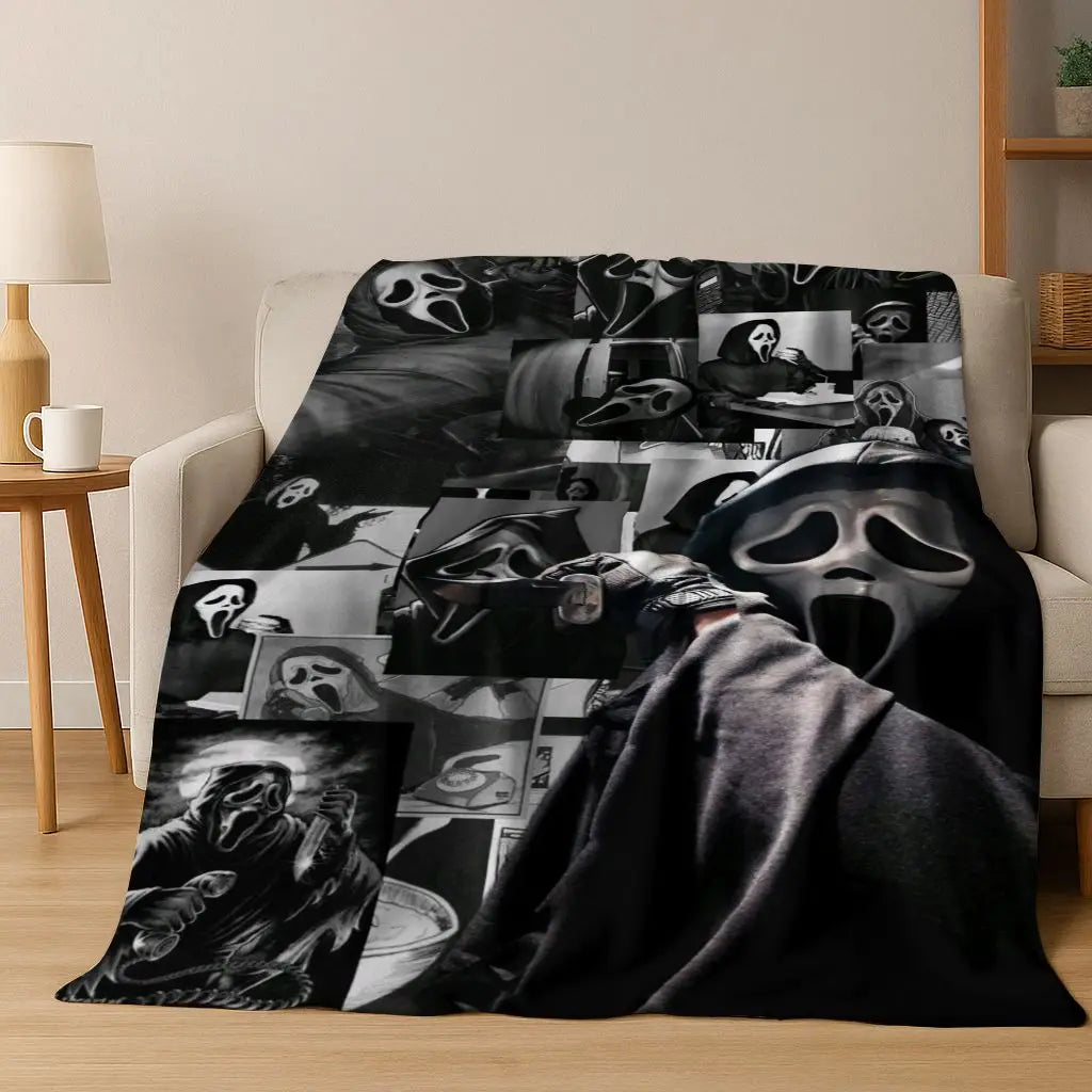 A dark flannel throw blanket featuring various horror movie characters and masks.