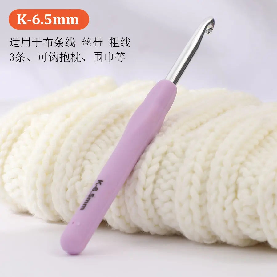 A K-6.5mm precision aluminum crochet hook is shown next to a ball of white yarn.