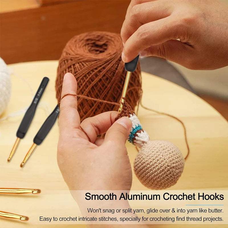 Hands are using smooth aluminum crochet hooks to work with yarn and create intricate stitches.
