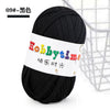 Black thick polyester craft yarn skein used for knitting and crochet