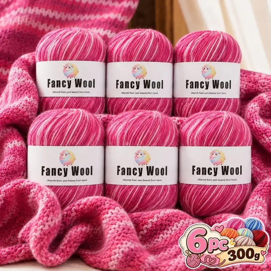 A set of pink gradient alpaca wool yarn skeins for knitting and crochet projects.