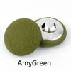 A set of round fabric-covered shank buttons in olive green and silver.