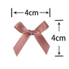 A pink satin ribbon bow measuring 4cm long, shown with dimension lines.