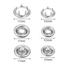 A set of precision iron snap buttons in silver metal, shown with various sizes and profiles.