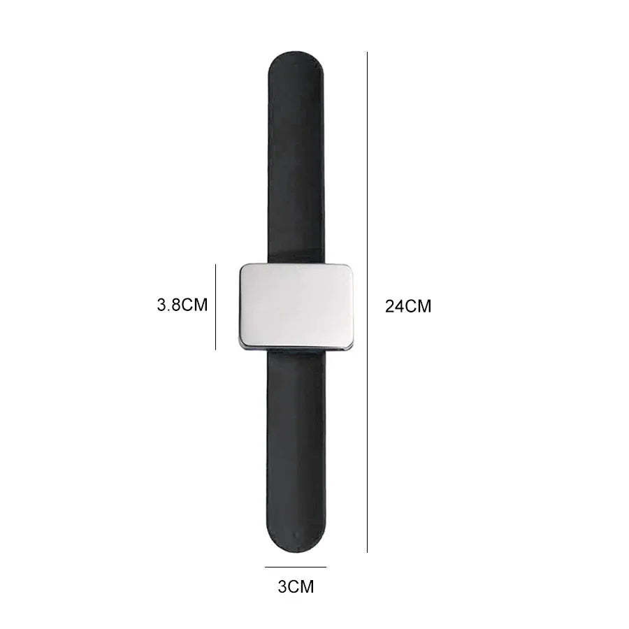 Black magnetic wrist pincushion with a silver silicone band shown in a vertical layout.