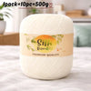 A ball of cream colored silk bamboo blend yarn labeled premium quality for knitting and crochet.