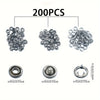 A set of 200 metal sewing buttons and snap fasteners in silver color.