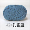 A ball of light blue knitting yarn labeled 42# 孔雀蓝