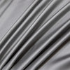 Gray luxury bamboo flat sheets draped and folded, showing soft texture and drape.
