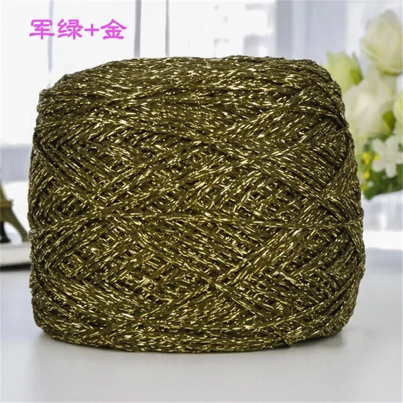 A ball of metallic gold silk yarn used for crocheting and knitting.