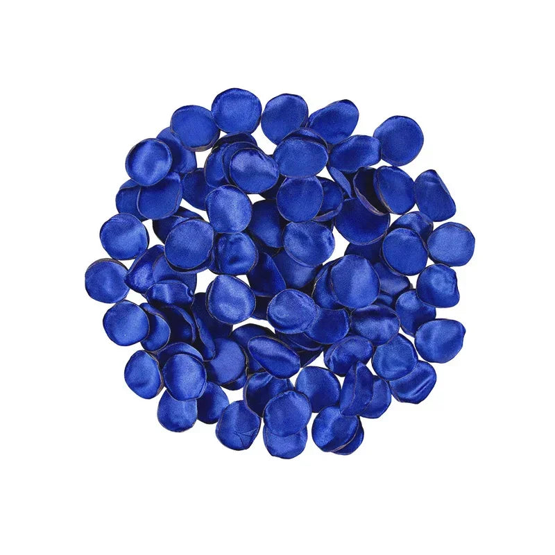 A pile of deep blue silk rose petals used for weddings and events.